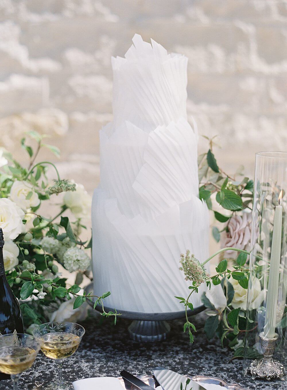 Structural white three tier wedding cake at cal-a-vie wedding - Jacqueline Benét Photography