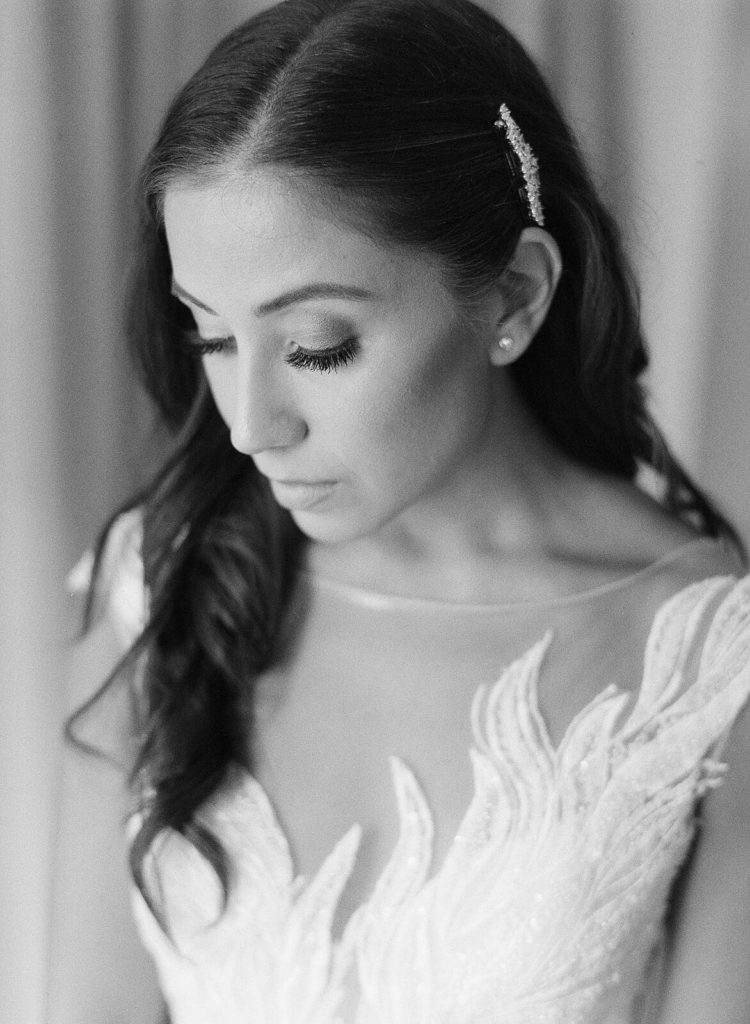 Black and white image of bride with jeweled barrette hair on one side - Jacqueline Benét Photography