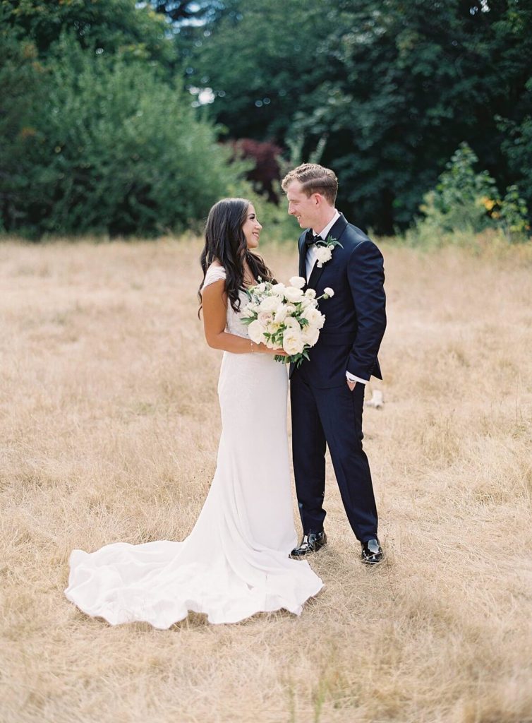 Bride and Groom look at each other at Discovery Park - Jacqueline Benét Photography