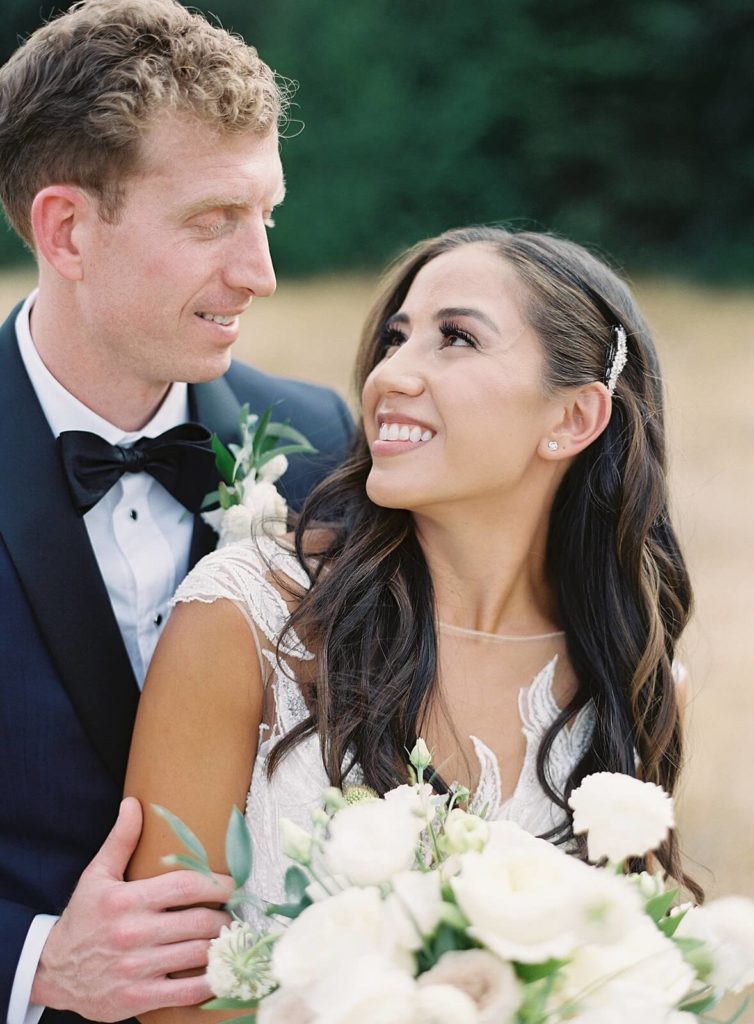 Bride and groom look at each other during portraits in Seattle - Jacqueline Benét Photography