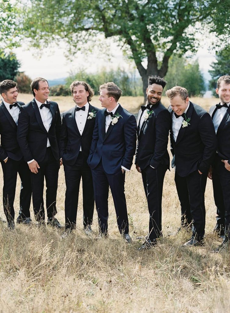 Groom and groomsmen laughing at Discovery Park - Jacqueline Benét Photography