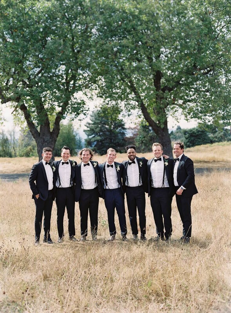 Groom and groomsmen in classic black tux and bowtie at Discovery Park - Jacqueline Benét Photography