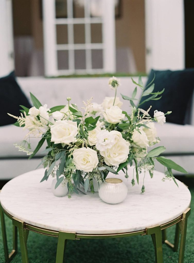 White cocktail hour floral arrangement in the lounge - Jacqueline Benét Photography