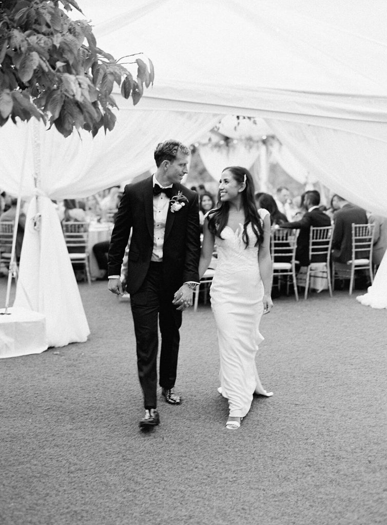 Bride and groom walk away from tent reception at Admirals House - Jacqueline Benét Photography
