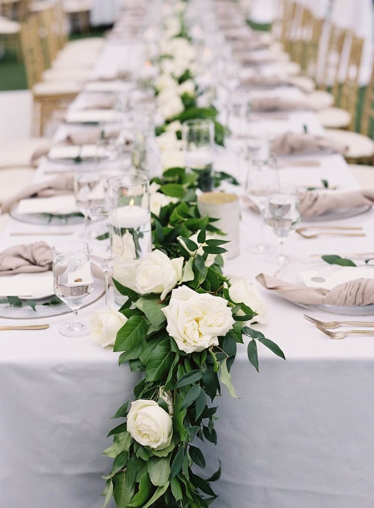 White and green floral garland on long tabletop at Admirals House wedding - Jacqueline Benét Photography