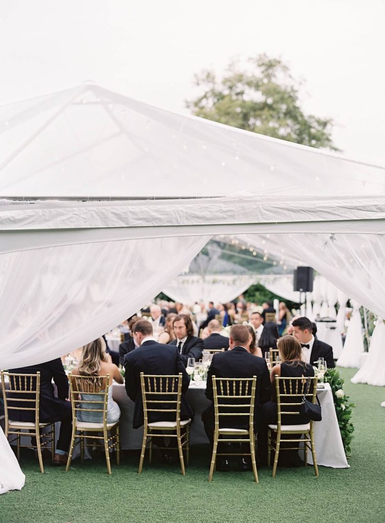 White reception tent at Admirals House wedding with gold chivari chairs - Jacqueline Benét Photography