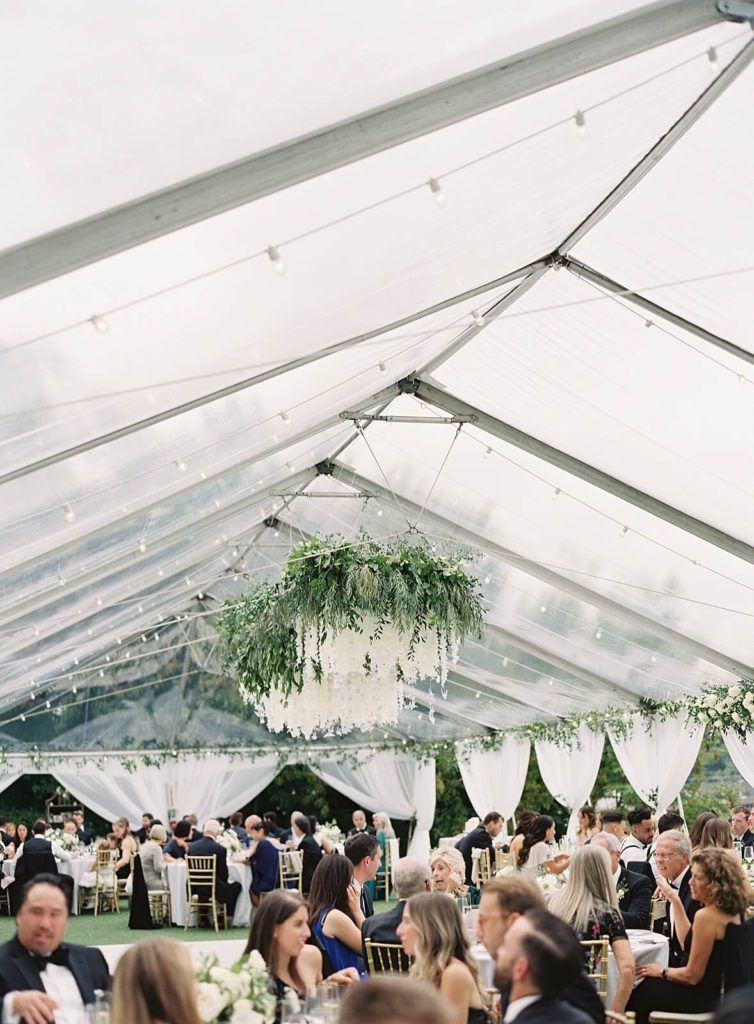 Clear wedding reception tent with hanging white florals at Admirals House - Jacqueline Benét Photography