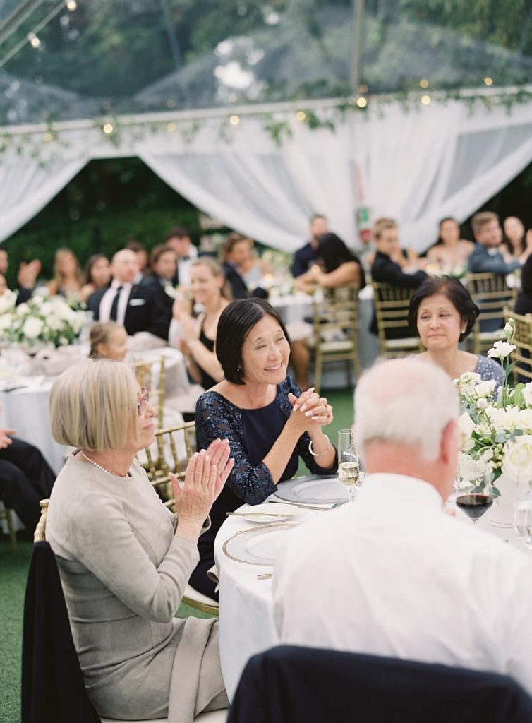 Guests clap during toasts at Seattle wedding - Jacqueline Benét Photography