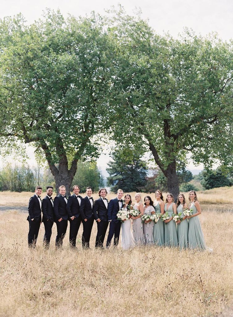 Bridal party in pastel green and lavender at Discovery Park by Seattle Wedding Photographer - Jacqueline Benét Photography