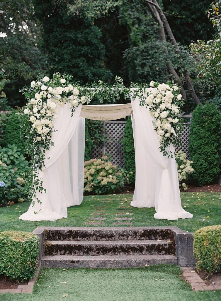 Ceremony chuppah with white flowers at Admirals House- Jacqueline Benét Photography