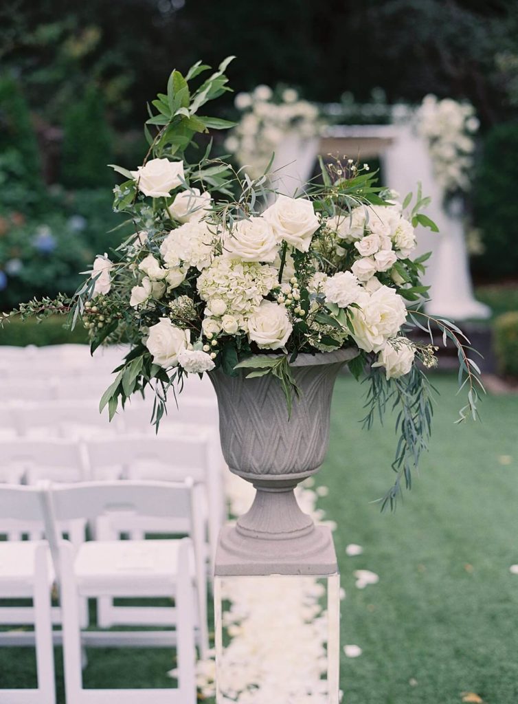 White flowers in urn at ceremony site in garden of Admirals House in Seattle -Jacqueline Benét Photography