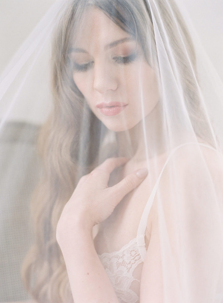 Bride under wedding veil during bridal boudoir session with Seattle boudoir Photographer Jacqueline Benét