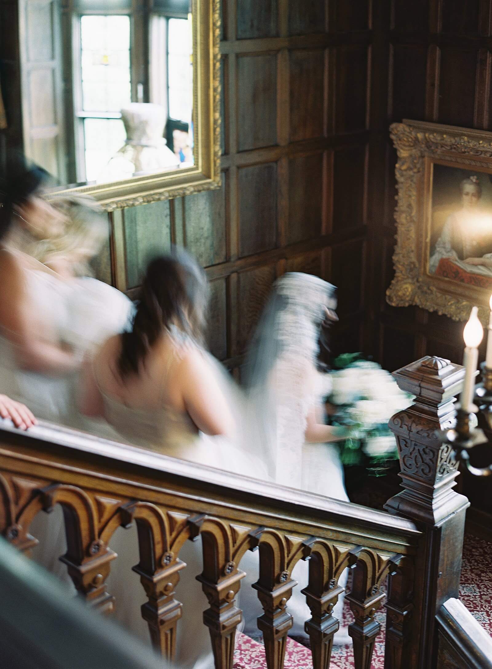 Motion blur of bride walking down the staircase of Thornewood Castle - Jacqueline Benét Photography