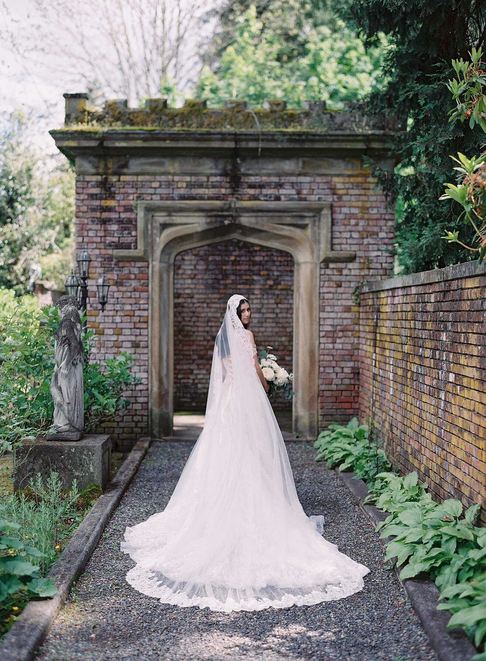 Bride with cathedral length lace veil from Girl and a Serious Dream outside at Thornewood Castle - Jacqueline Benét Photography