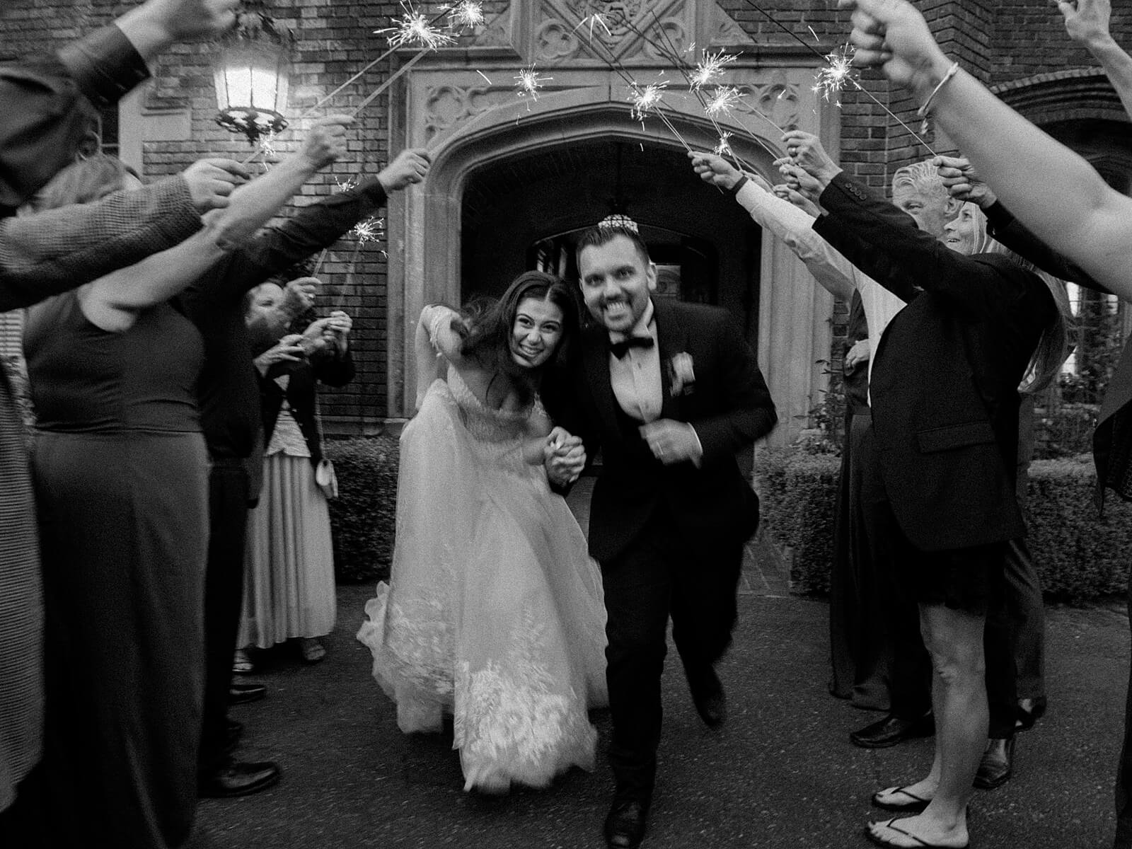Bride and Groom sparkler exit outside Thornewood Castle - Jacqueline Benét Photography