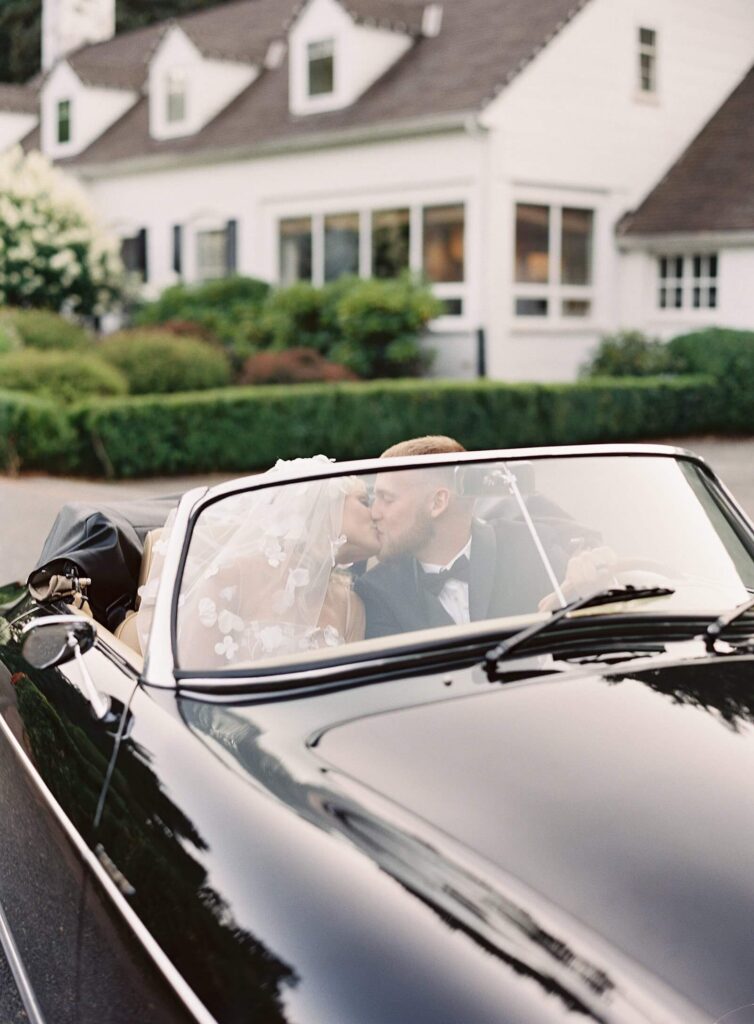Bride and groom getaway in convertible at Fox Hollow Farm with Jacqueline Benét Photography