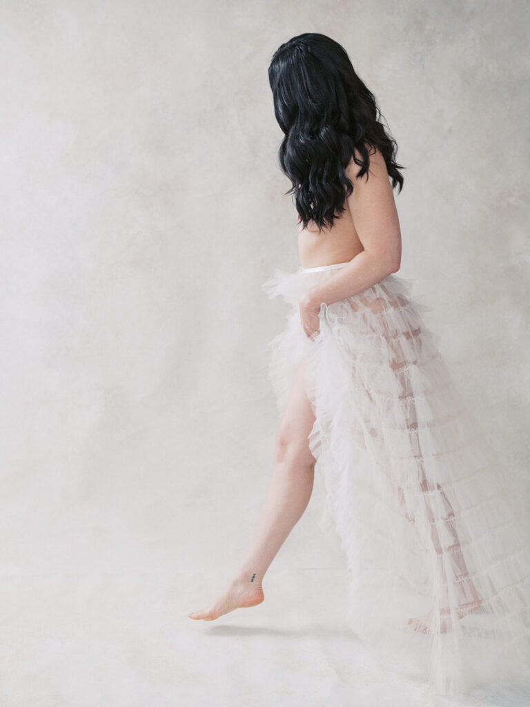 woman posing at bridal boudoir session in seattle