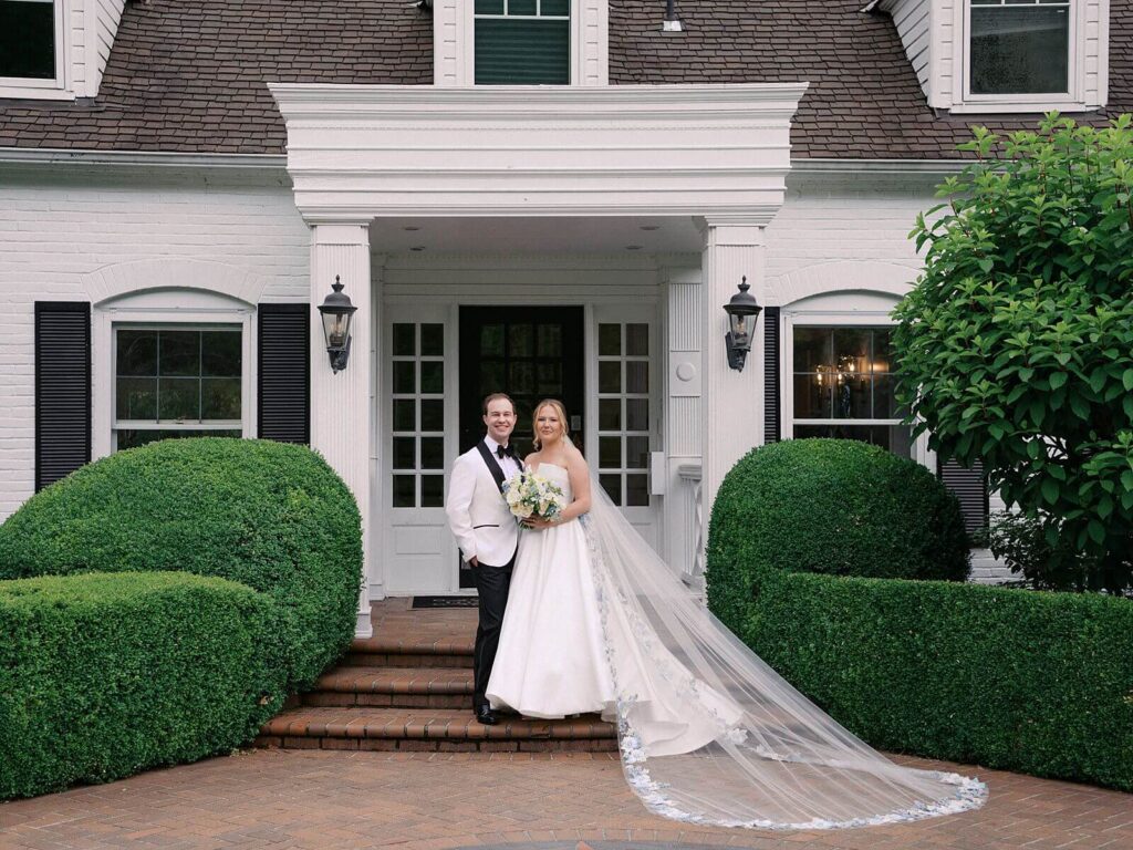Bride and groom sharing a joyful moment after the ceremony in the gardens at Fox Hollow Farm, photographed by Jacqueline Benét | Seattle wedding photography