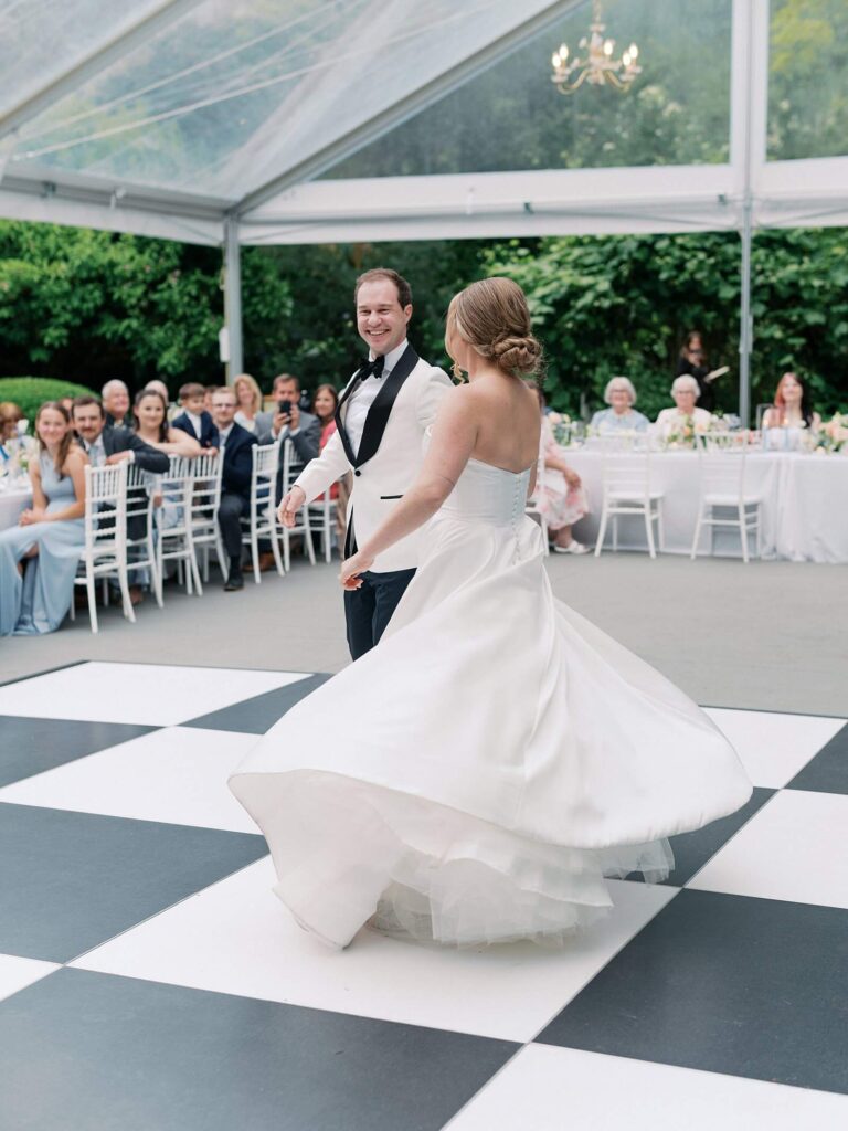 Bride and groom sharing their first dance beneath sparkling chandeliers at Fox Hollow Farm, photographed by Jacqueline Benét | Fox Hollow Farm wedding