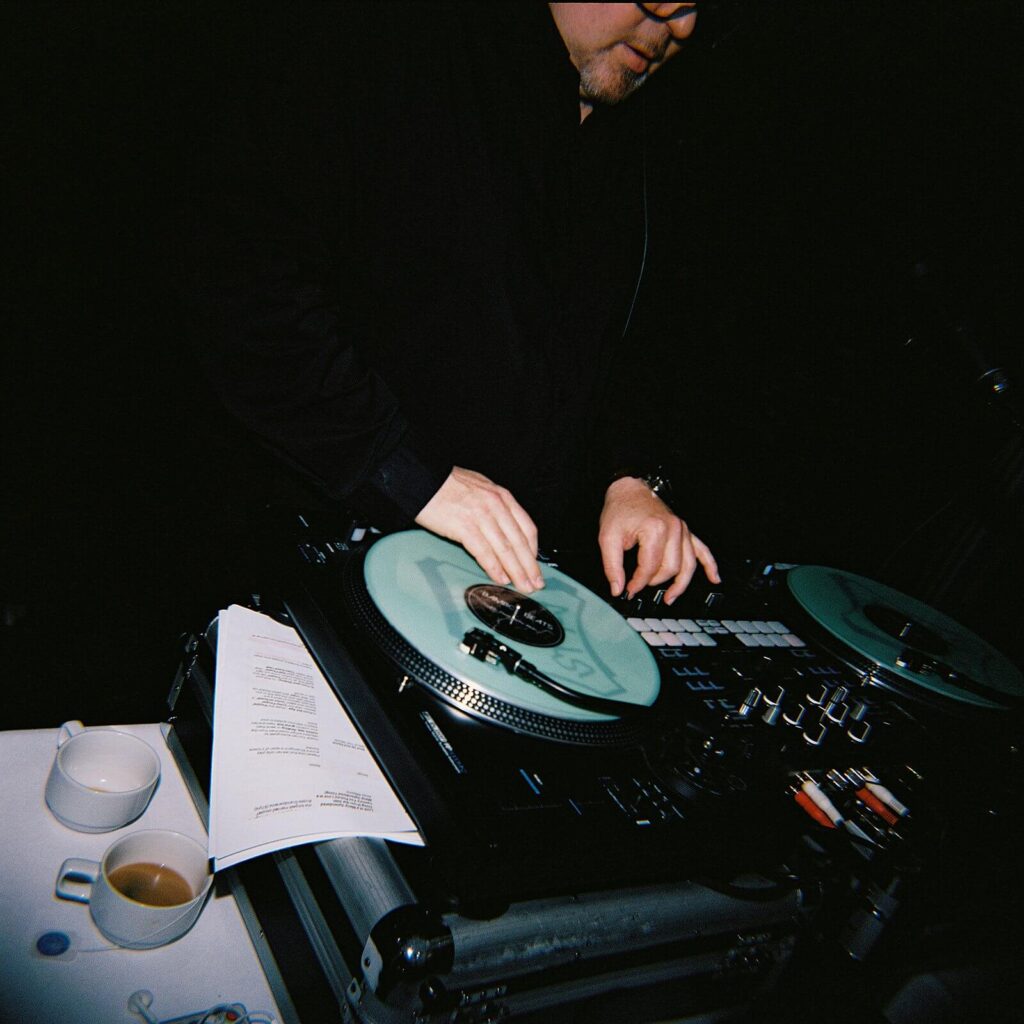 The DJ mixing beats at a romantic outdoor garden wedding at Fox Hollow Farm in Seattle. Seattle Wedding photography 