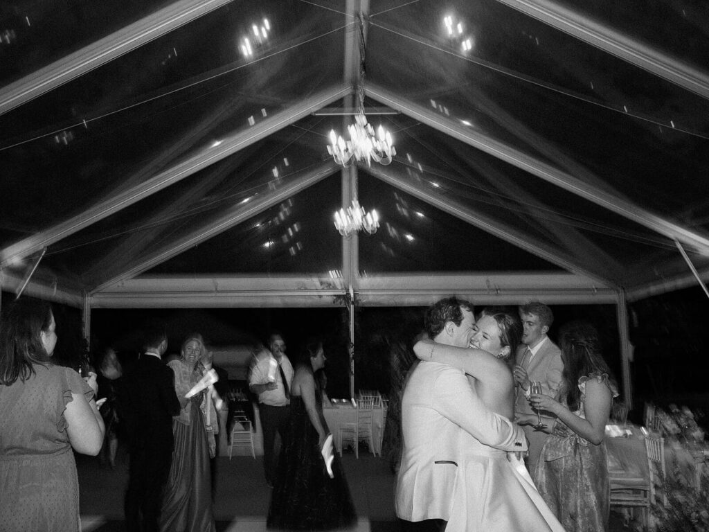 The bride and groom embraced and enjoying a sweet moment together on the dance floor during their wedding at Fox Hollow Farms - Seattle wedding photos 