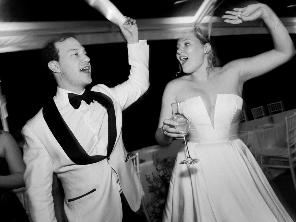 The bride and groom singing together enjoying a sweet moment together on the dance floor during their wedding at Fox Hollow Farms - Seattle wedding photos 