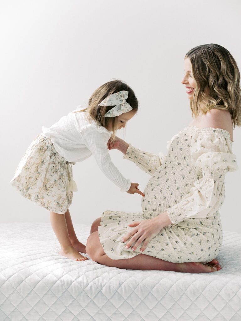 Family maternity picture pose focused on connection and presence