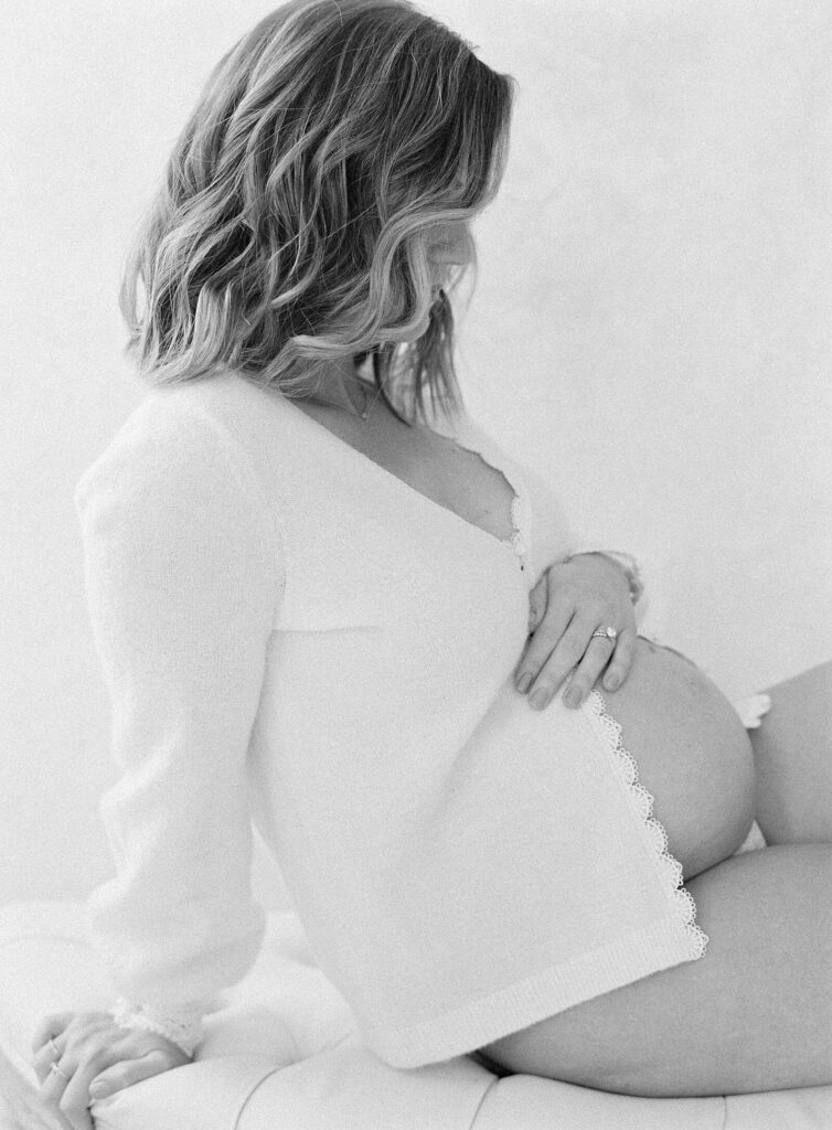 Seated maternity picture pose captured by Seattle maternity photographer, Jacqueline Benét