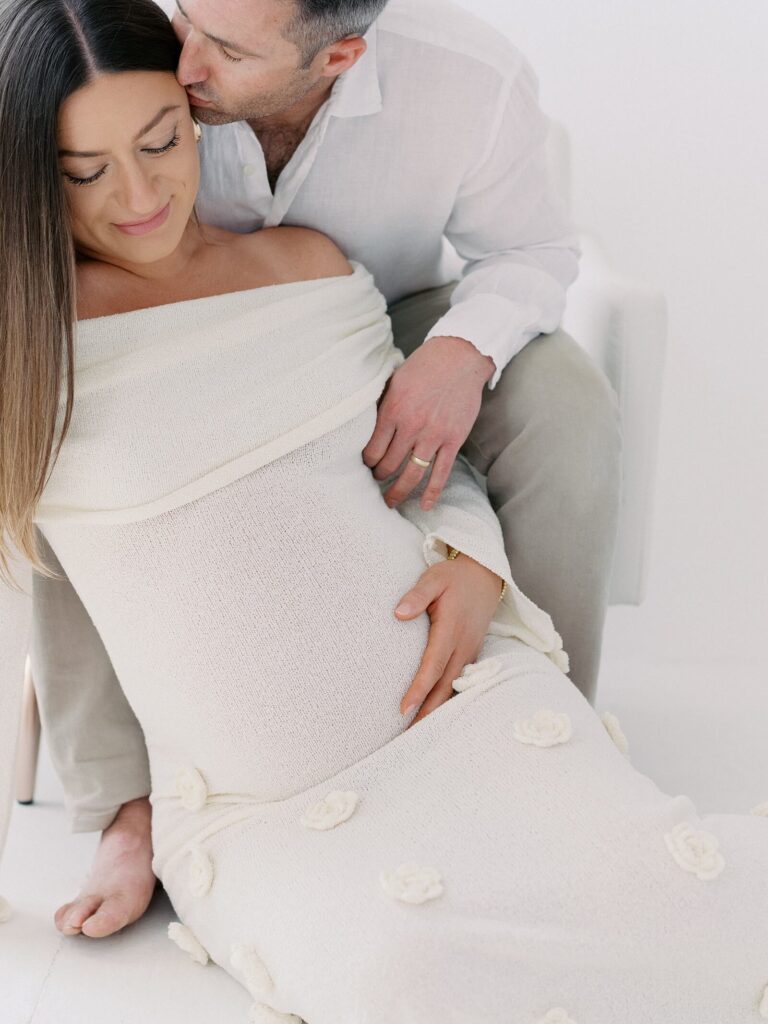 Romantic maternity photos couple posing together in Seattle studio